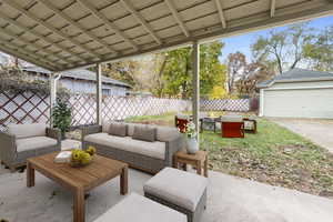 View of patio featuring an outdoor living space  (Staged by AI)