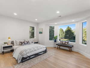 Bedroom with light hardwood / wood-style floors