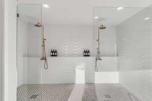 Bathroom featuring tiled shower