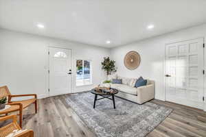 Living room with light wood-type flooring