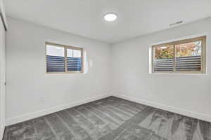 Unfurnished room with carpet floors