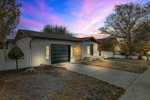 View of front of property featuring a garage