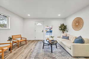 Living room with light hardwood / wood-style flooring