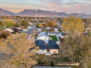 Aerial view at dusk featuring a mountain view