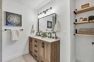 Bathroom with tile patterned flooring and vanity