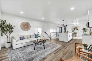 Living room featuring light hardwood / wood-style floors and sink