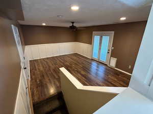 Entryway with ceiling fan and dark hardwood / wood-style floors