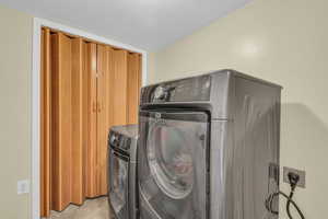 Washroom featuring washer and dryer