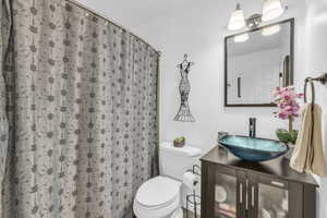 Bathroom with vanity and toilet