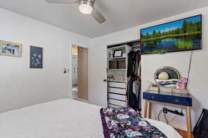 Bedroom with a closet and ceiling fan