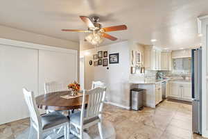 Dining room featuring ceiling fan