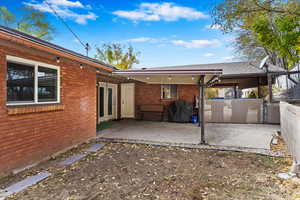 Rear view of property featuring a patio area