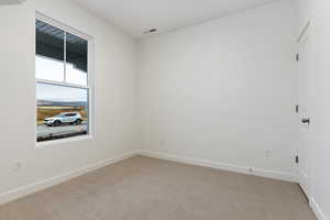 View of carpeted spare room