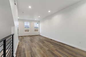 Unfurnished living room with hardwood / wood-style floors