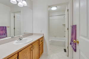 Full bathroom with shower / bathing tub combination, vanity, and toilet