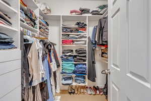 Walk in closet featuring carpet floors