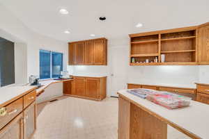 Kitchen with built in desk and kitchen peninsula