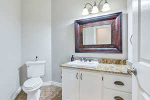 Bathroom featuring toilet and vanity