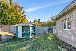 View of yard with an outbuilding