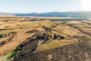 Birds eye view of property featuring a mountain view and a rural view