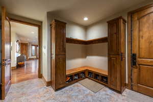 Mudroom with light hardwood / wood-style floors