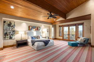 Bedroom featuring access to exterior, ceiling fan, french doors, wooden ceiling, and vaulted ceiling with beams