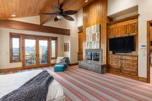 Bedroom with access to exterior, ceiling fan, wooden ceiling, high vaulted ceiling, and a mountain view