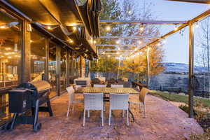 Patio terrace at dusk with a mountain view