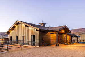 View of front of home featuring a mountain view and an outdoor structure