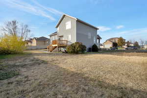 Rear view of property with a deck