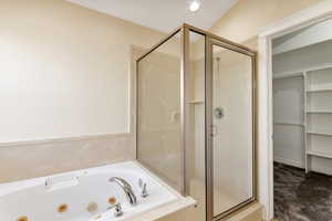 Bathroom featuring separate shower and tub