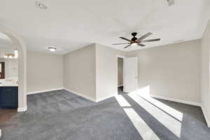 Primary bedroom with sitting area.