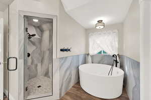 Primary Bath with relaxing oversized soaking tub and separate shower.