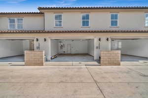 Back of house with a garage