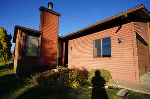 View of home's exterior featuring a garage