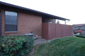 View of property exterior with a lawn