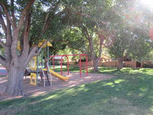 View of jungle gym with a yard