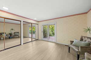 Sitting room with light hardwood / wood-style floors