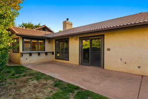 Rear view of property with a patio area