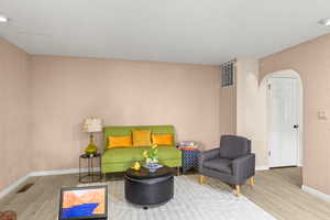 Sitting room featuring light hardwood / wood-style flooring