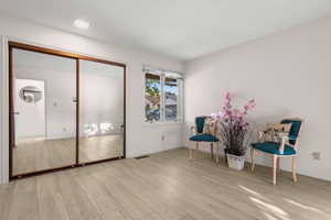 Living area featuring light hardwood / wood-style floors