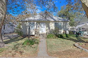 Bungalow-style house with a front yard