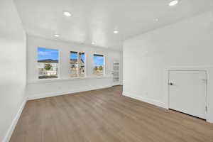 Interior space with plenty of natural light and light hardwood / wood-style floors