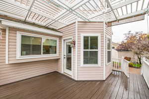 Deck featuring a pergola