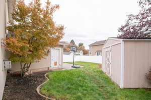 View of yard featuring a storage shed