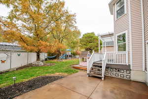 View of patio / terrace with a pergola, a playground, and a wooden deck