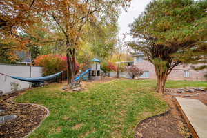 View of yard featuring a playground