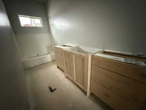 Bathroom with concrete flooring