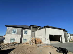 View of front of property with a garage