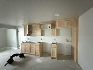 Kitchen with light brown cabinets